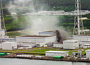 Black smoke rises from a burning electrical transformer near one of  the Kashiwazaki-Kariwa nuclear reactors.